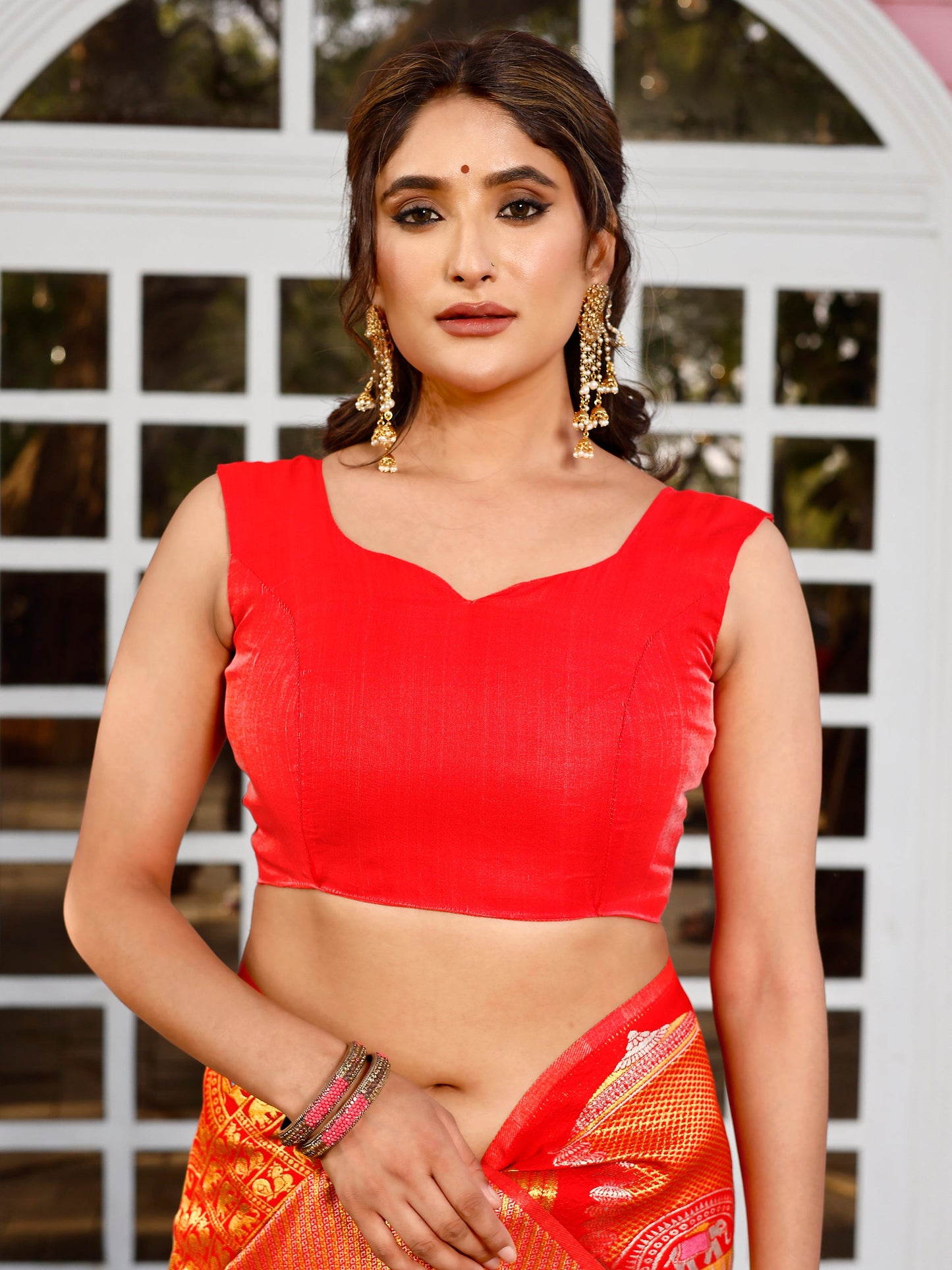 Supreme Off White and Coral Silk Saree with Intricate Zari Work
