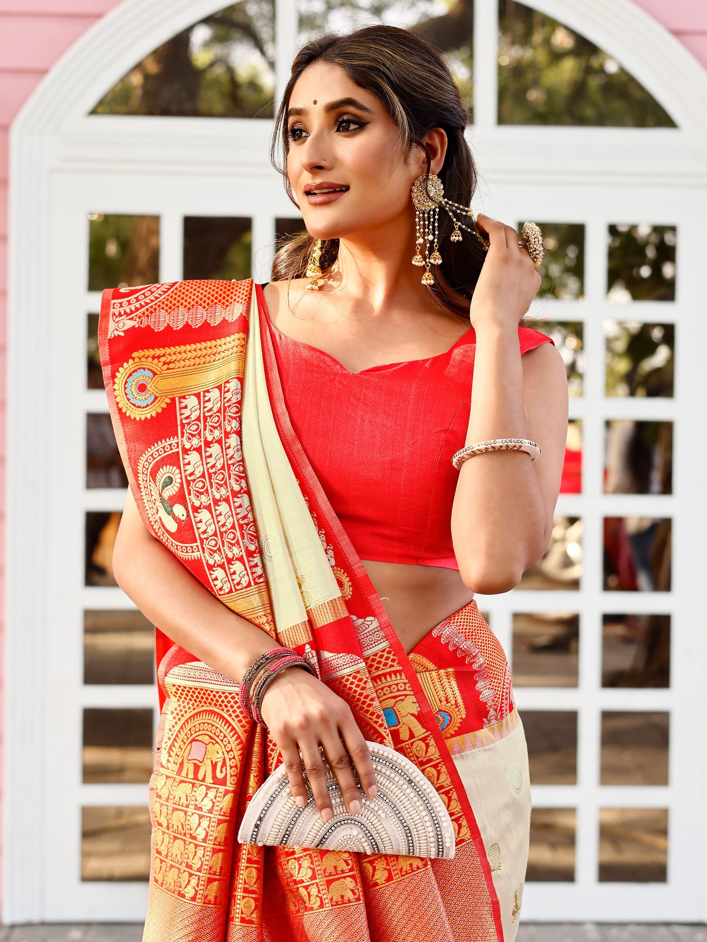 Supreme Off White and Coral Silk Saree with Intricate Zari Work