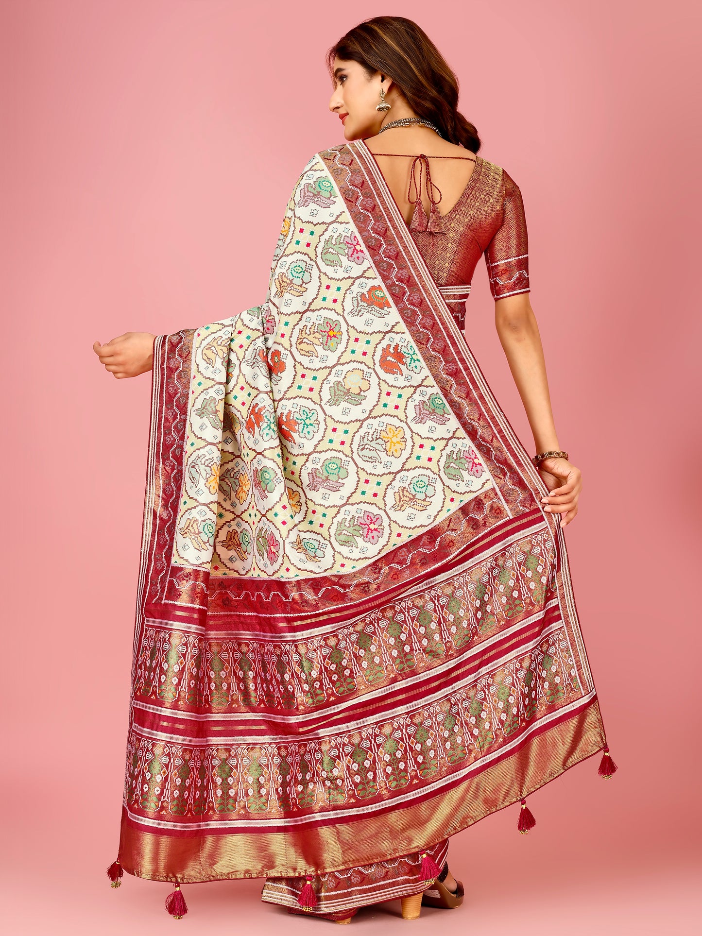 Maroon and Cream Color Women's Soft Patola Silk meenakari weawing motifs with Rich Zari Pallu and contrast border with Tessels.