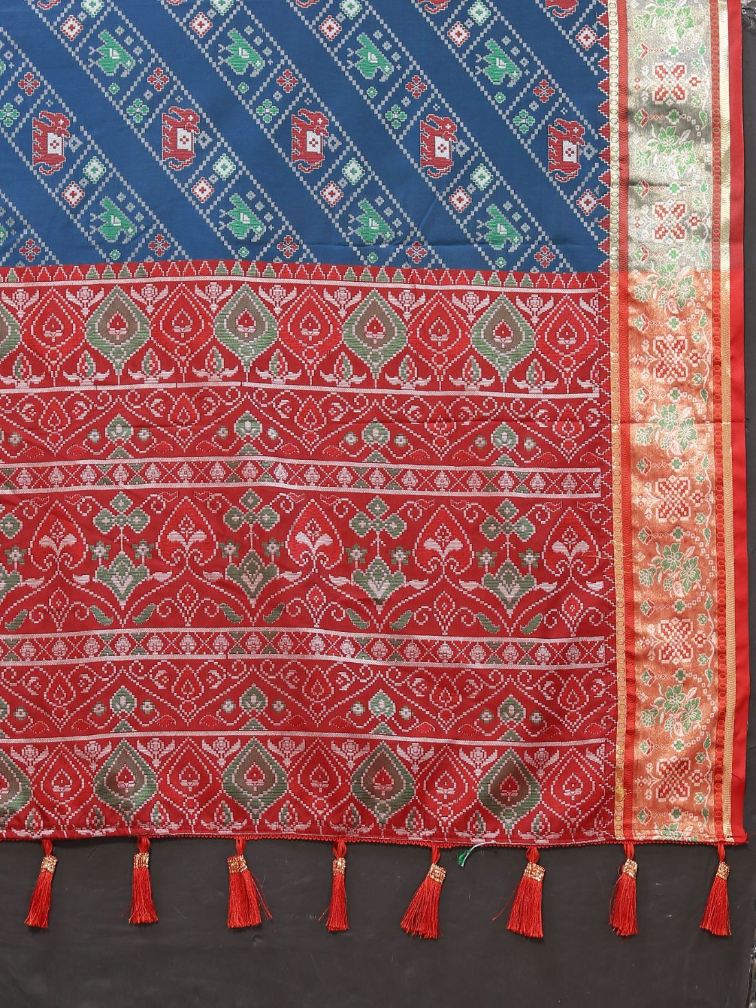 Blue & Maroon Color Women's Soft Patola Silk meenakari weawing motifs with Rich Zari Pallu and contrast border with Tessels.