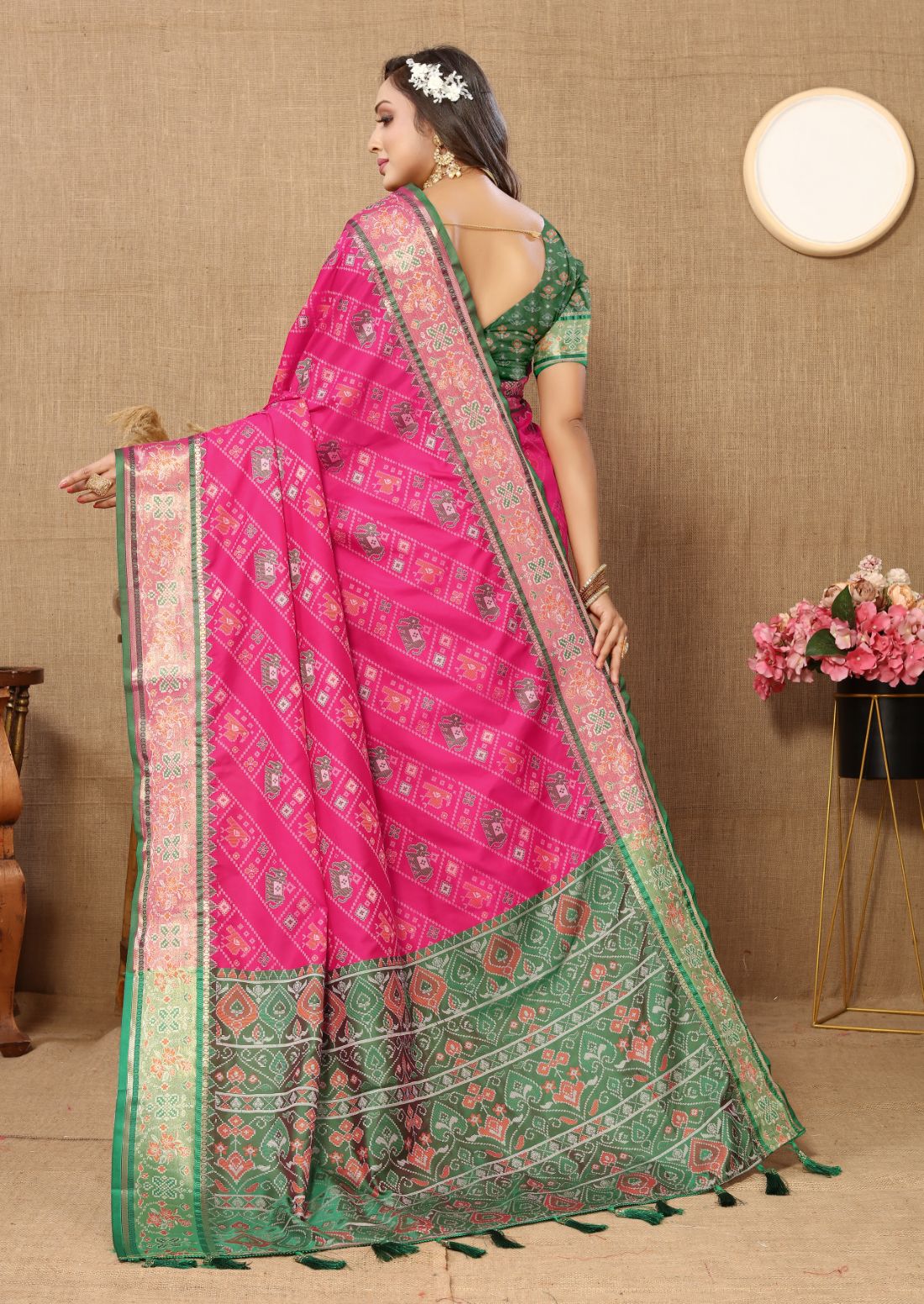 Pink & Green Color Women's Soft Patola Silk meenakari weawing motifs with Rich Zari Pallu and contrast border with Tessels.
