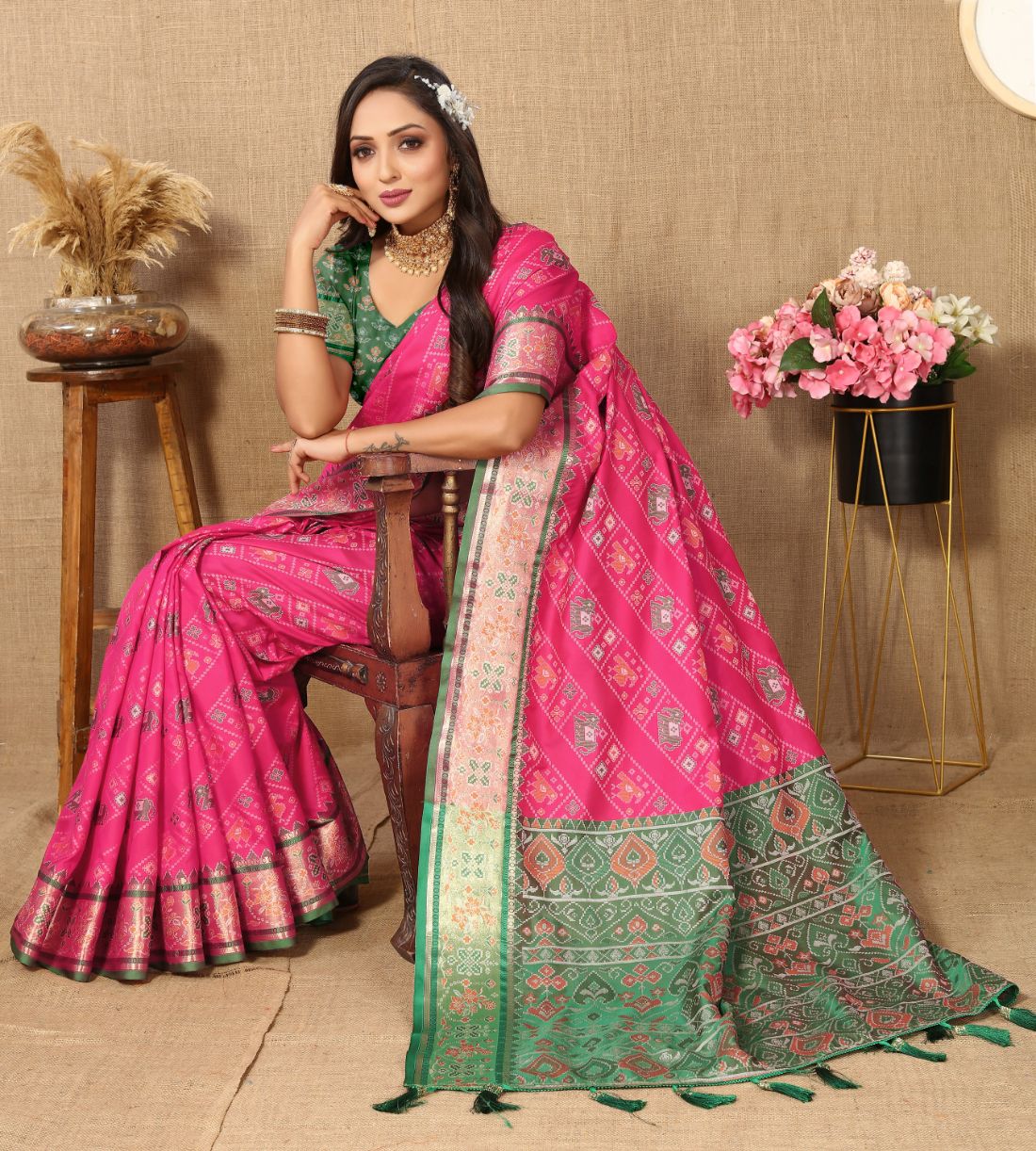 Pink & Green Color Women's Soft Patola Silk meenakari weawing motifs with Rich Zari Pallu and contrast border with Tessels.