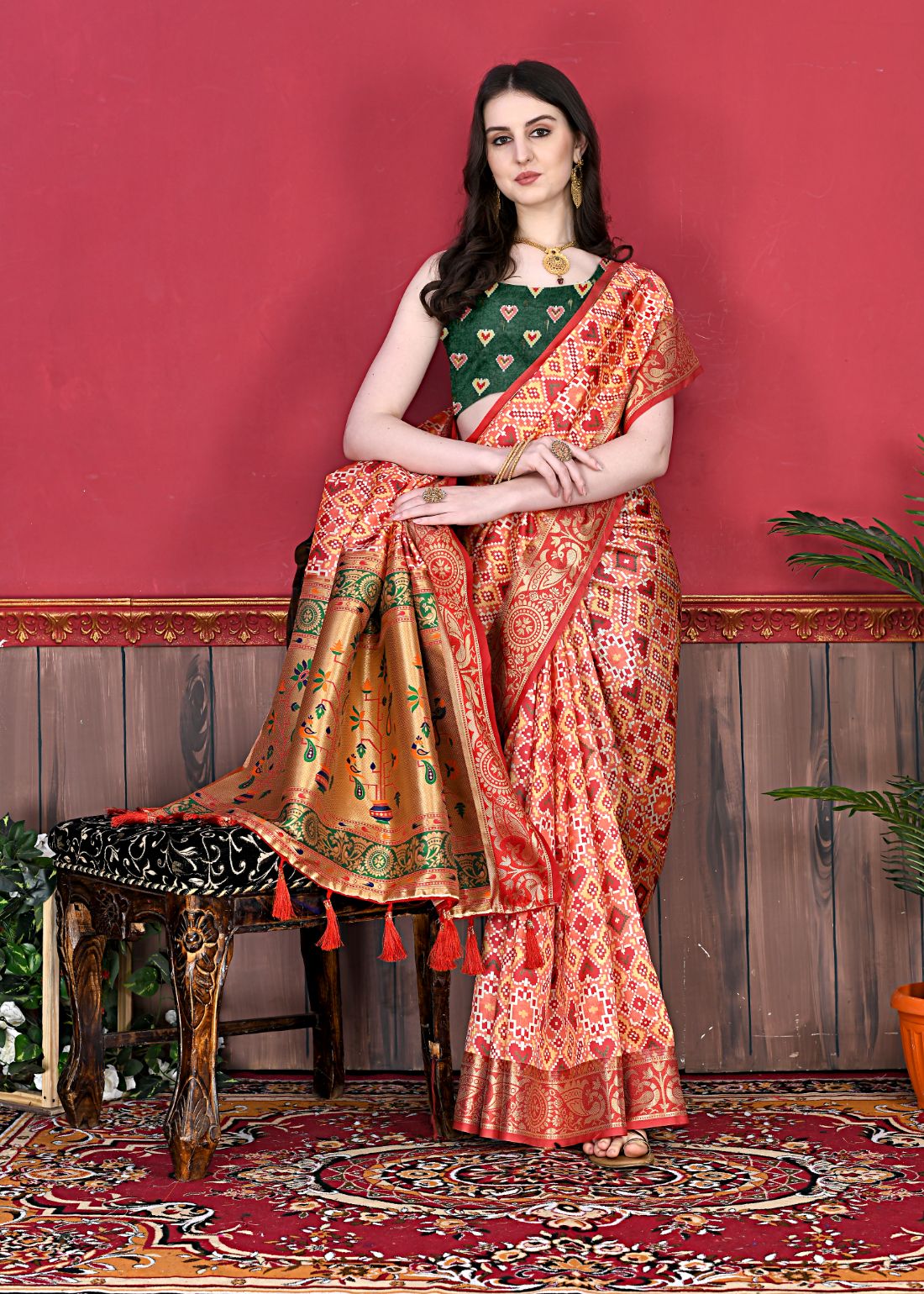 Red Color Women's Soft Patola Silk meenakari weawing motifs with Rich Zari Pallu and contrast border with Tessels.