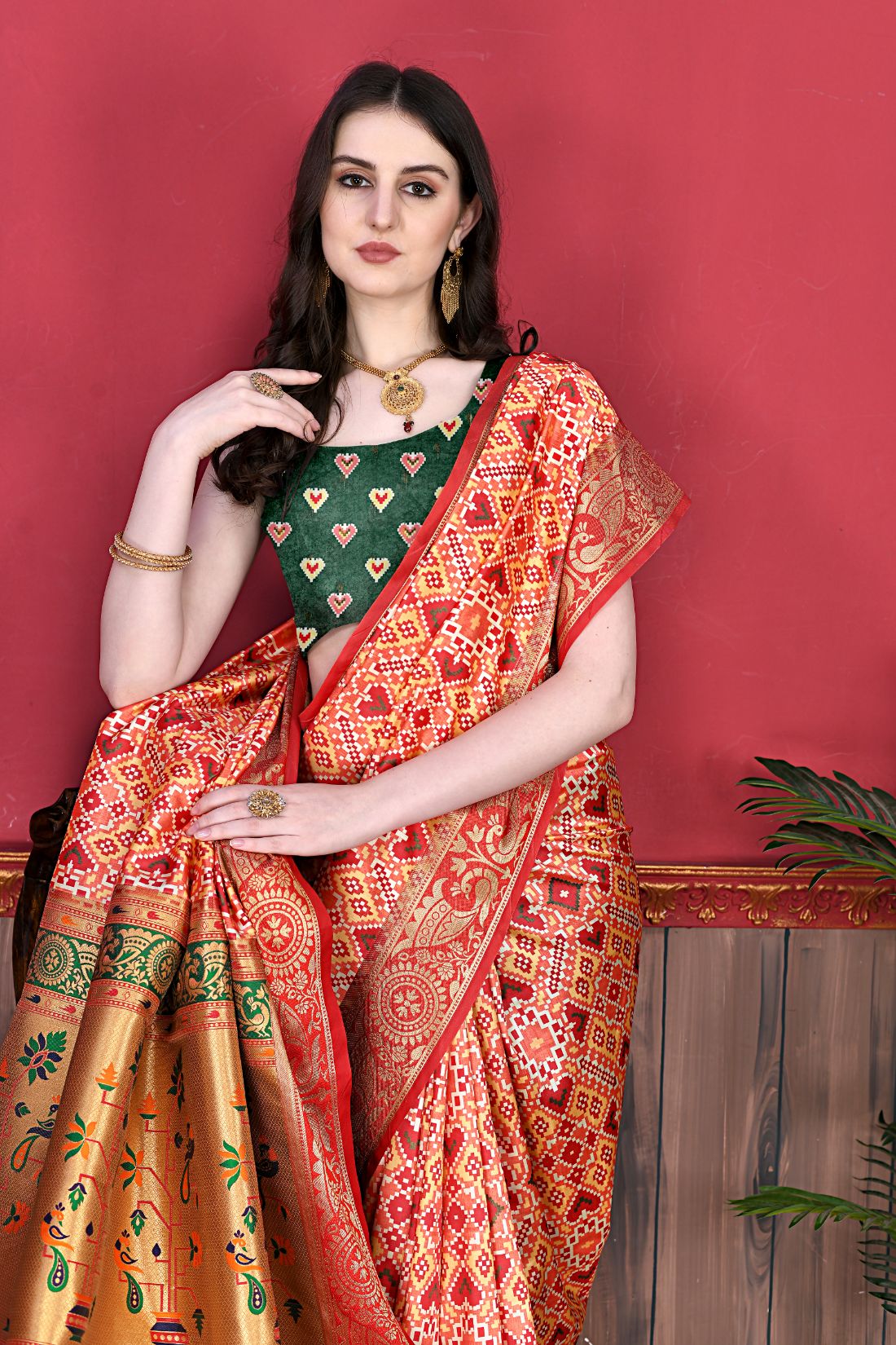 Red Color Women's Soft Patola Silk meenakari weawing motifs with Rich Zari Pallu and contrast border with Tessels.