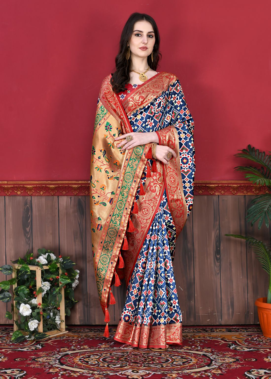 Nevy Blue Color Women's Soft Patola Silk meenakari weawing motifs with Rich Zari Pallu and contrast border with Tessels.