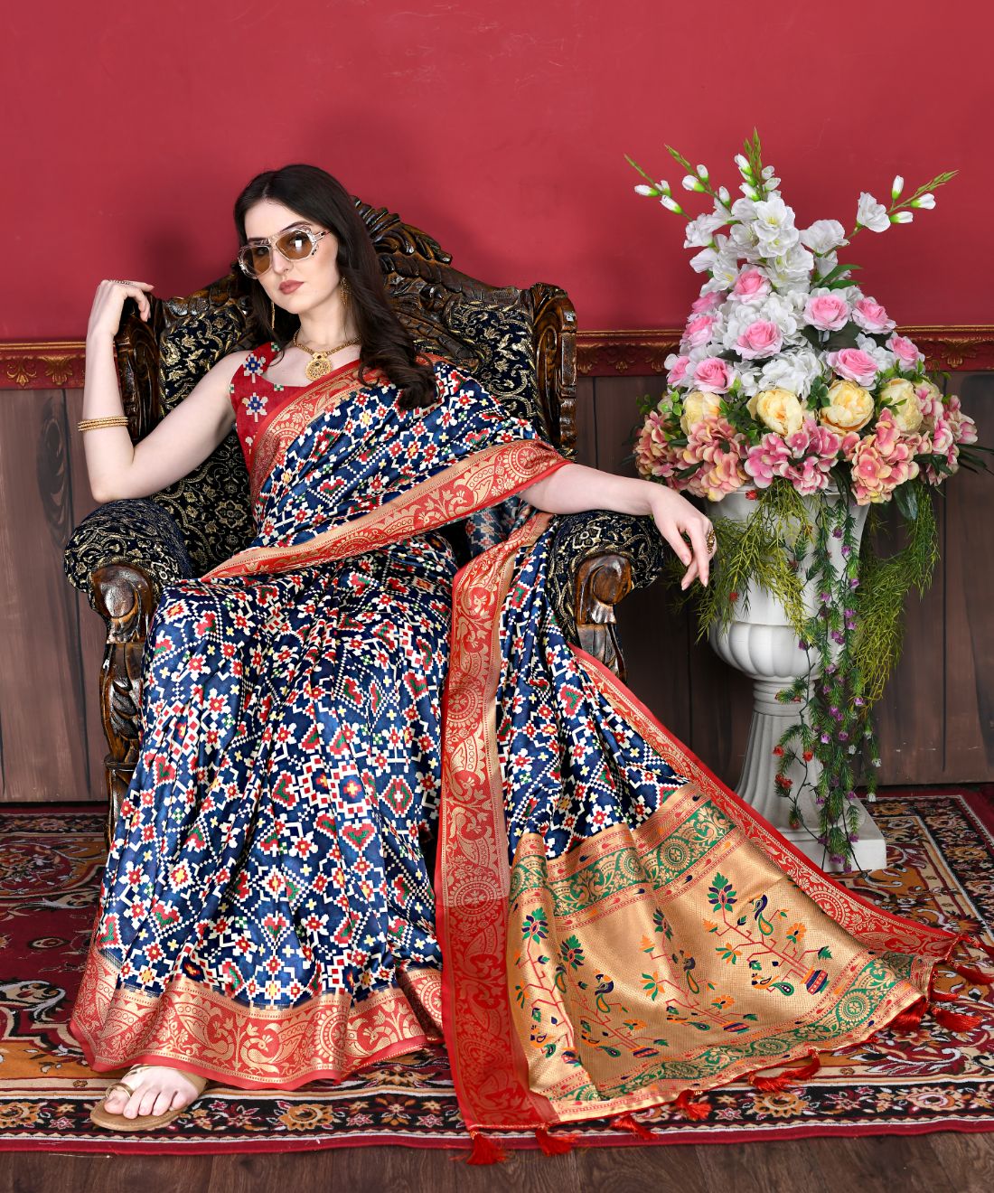 Nevy Blue Color Women's Soft Patola Silk meenakari weawing motifs with Rich Zari Pallu and contrast border with Tessels.
