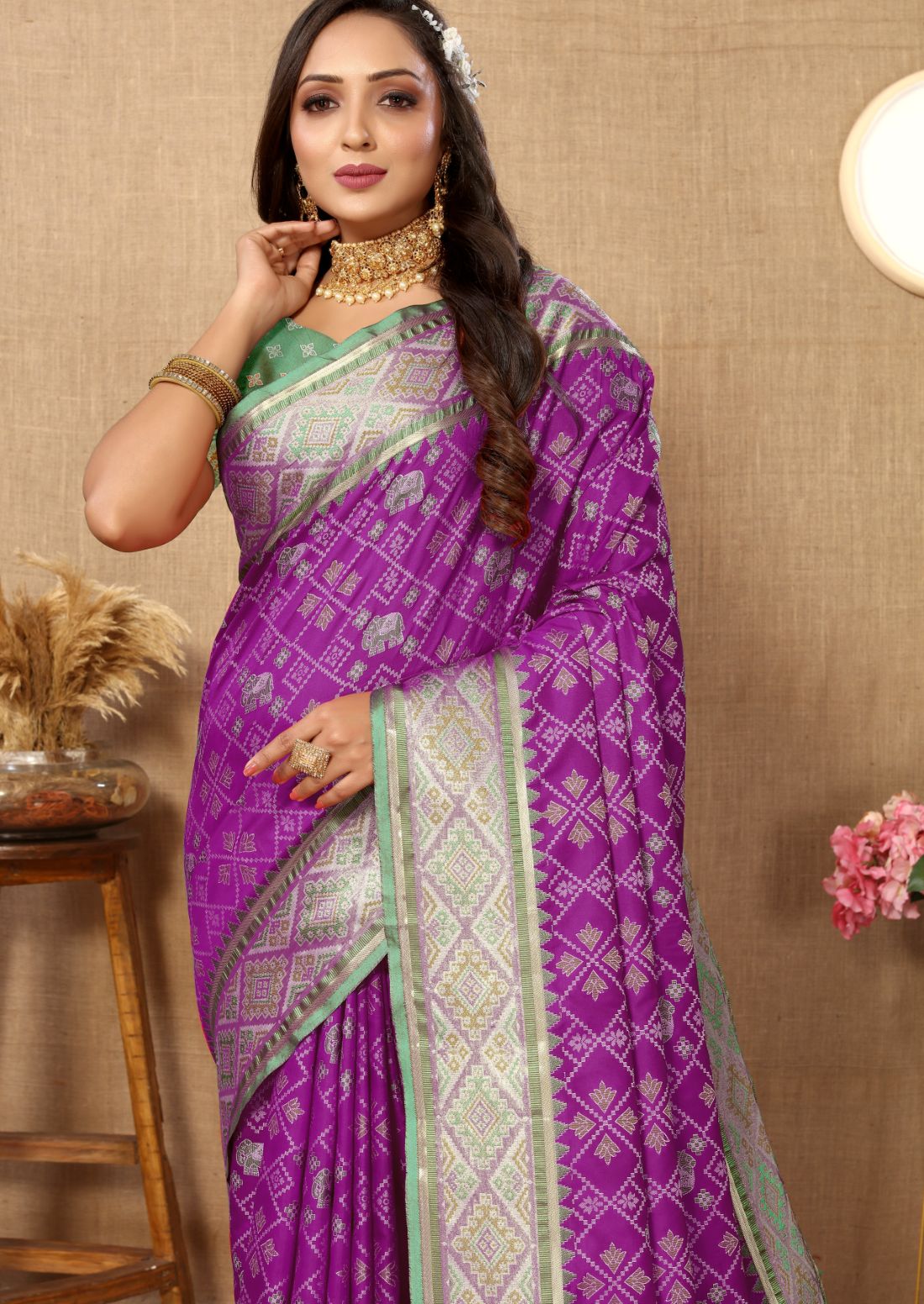 Purple & Green Color Women's Soft Patola Silk meenakari weawing motifs with Rich Zari Pallu and contrast border with Tessels.