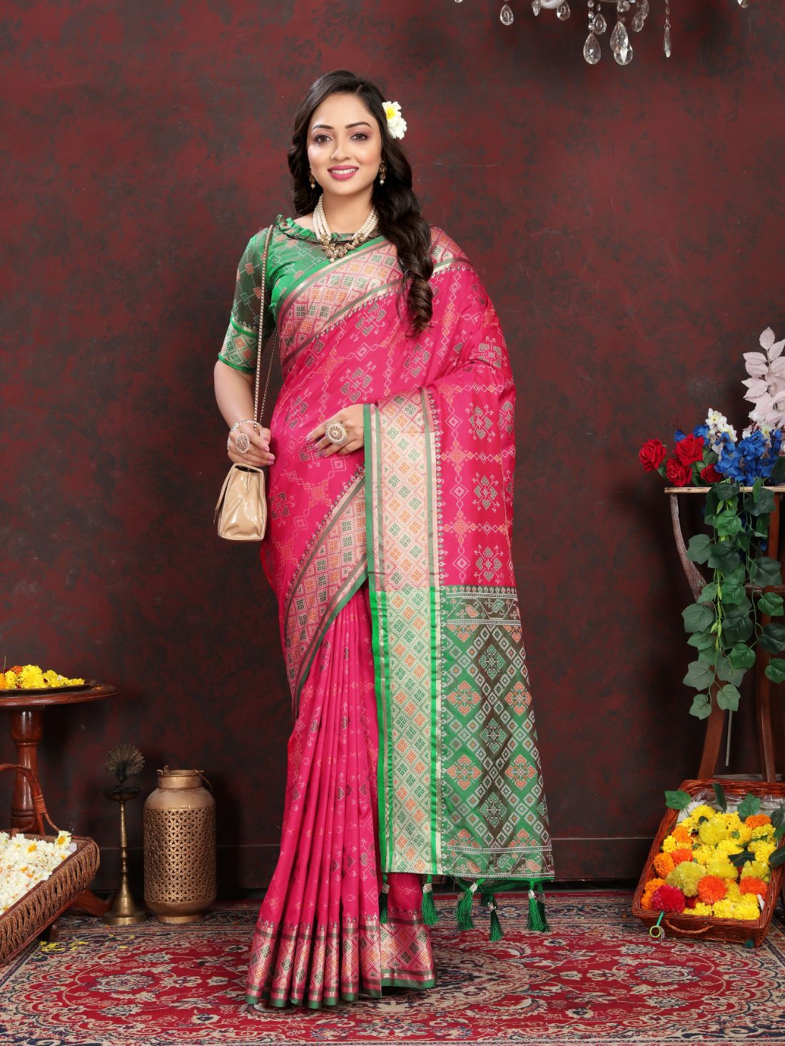 Pink & Green Color Women's Soft Patola Silk meenakari weawing motifs with Rich Zari Pallu and contrast border with Tessels.