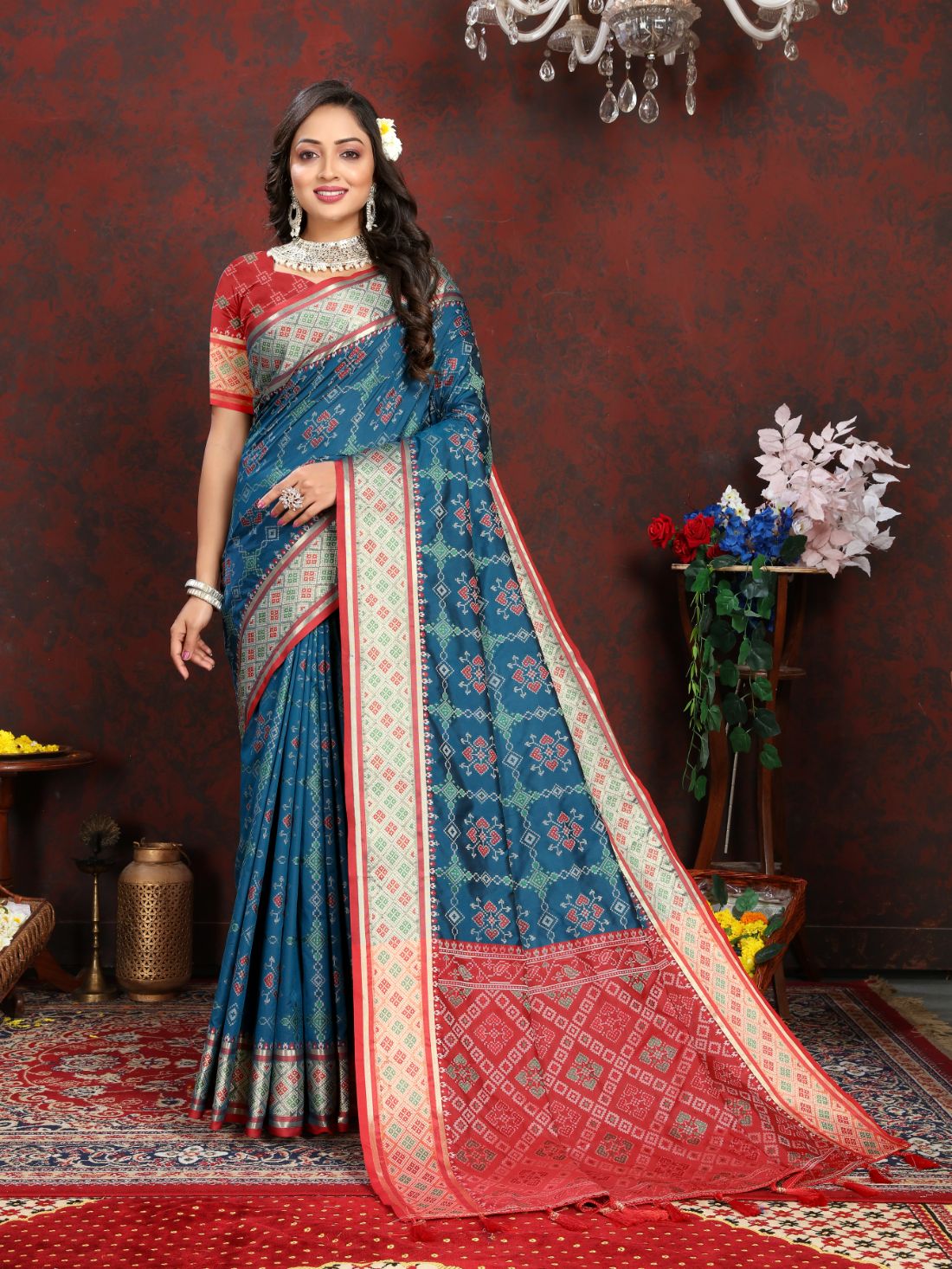 Blue & Red Color Women's Soft Patola Silk meenakari weawing motifs with Rich Zari Pallu and contrast border with Tessels.