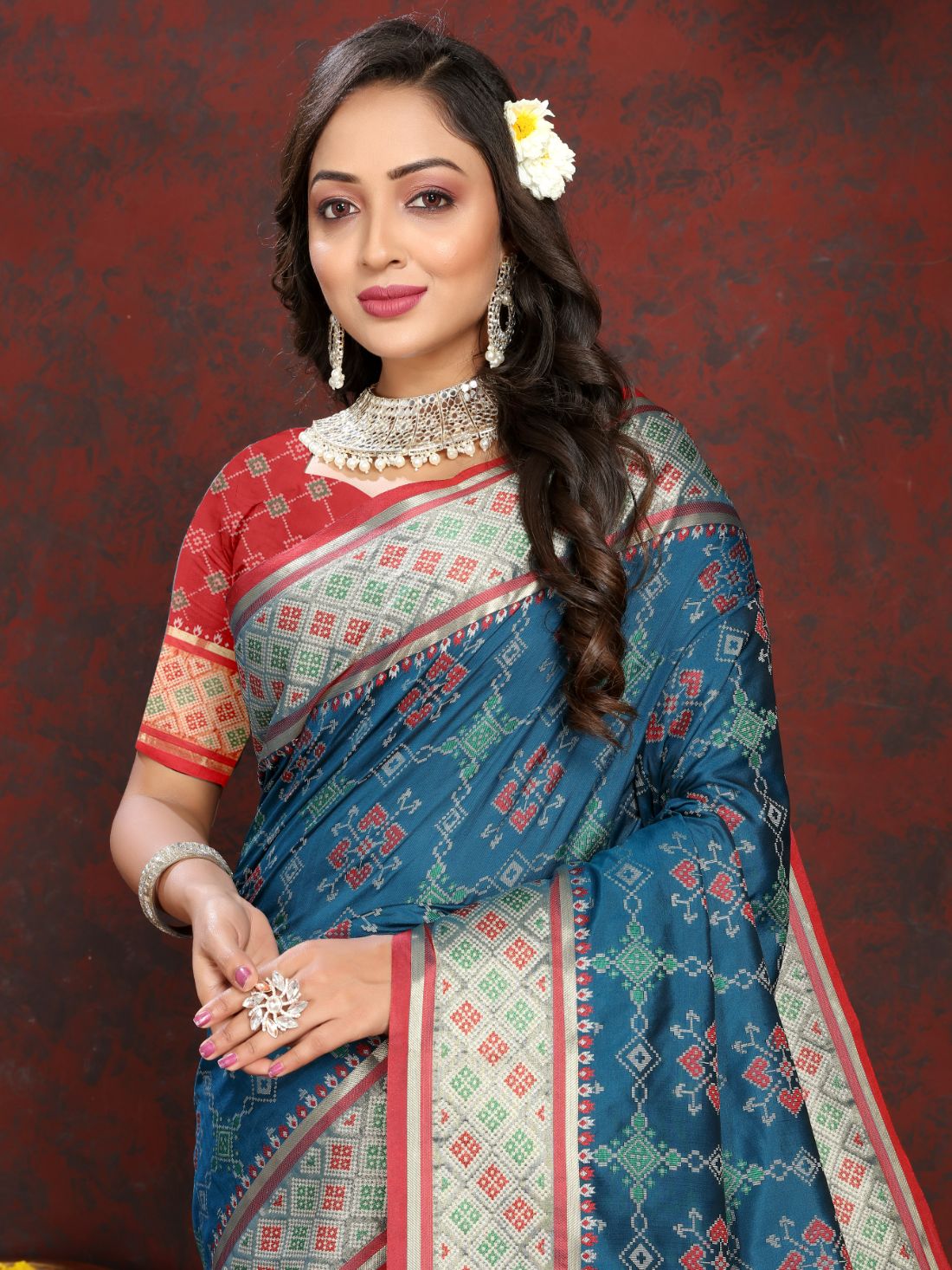 Blue & Red Color Women's Soft Patola Silk meenakari weawing motifs with Rich Zari Pallu and contrast border with Tessels.