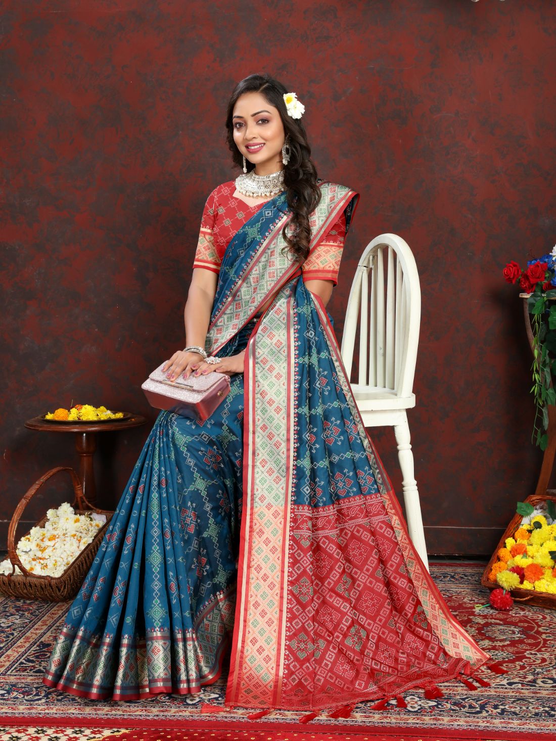 Blue & Red Color Women's Soft Patola Silk meenakari weawing motifs with Rich Zari Pallu and contrast border with Tessels.