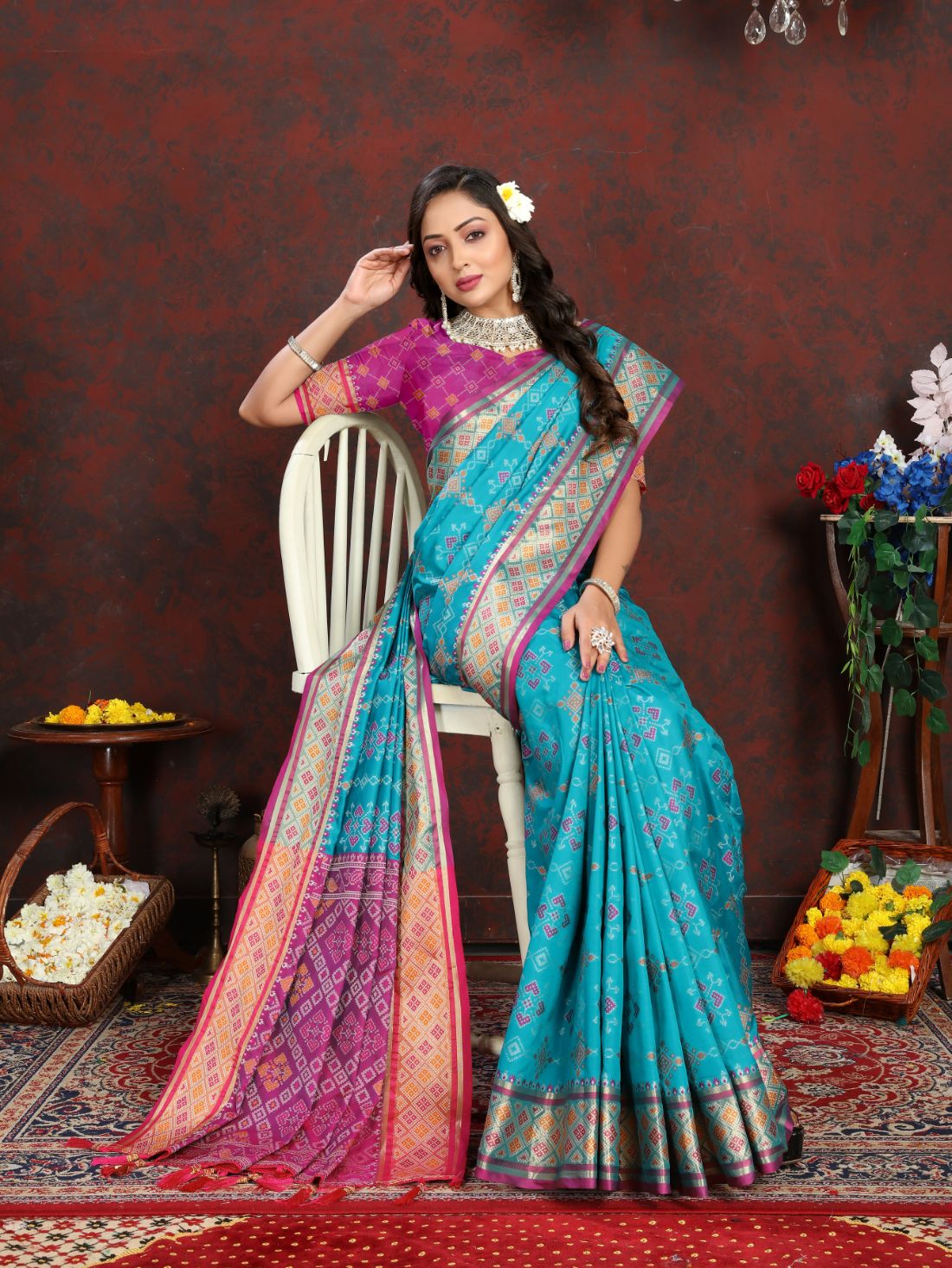 Light Blue & Pink Color Women's Soft Patola Silk meenakari weawing motifs with Rich Zari Pallu and contrast border with Tessels.