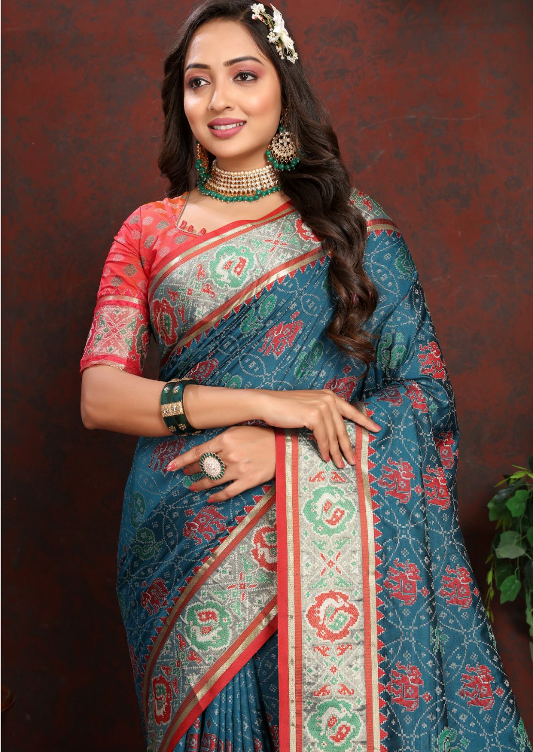 Nevy Blue & Red Women's Soft Patola Silk meenakari weawing motifs with Rich Zari Pallu and contrast border with Tessels.