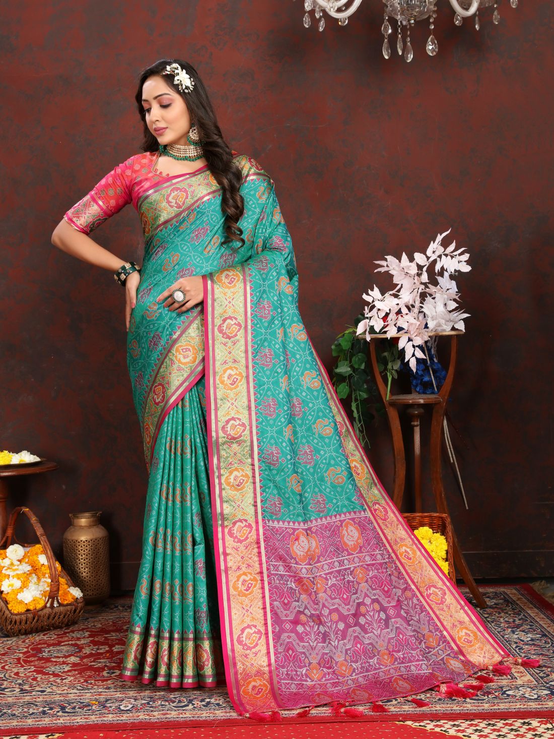 Aqua Blue & Pink Women's Soft Patola Silk meenakari weawing motifs with Rich Zari Pallu and contrast border with Tessels.