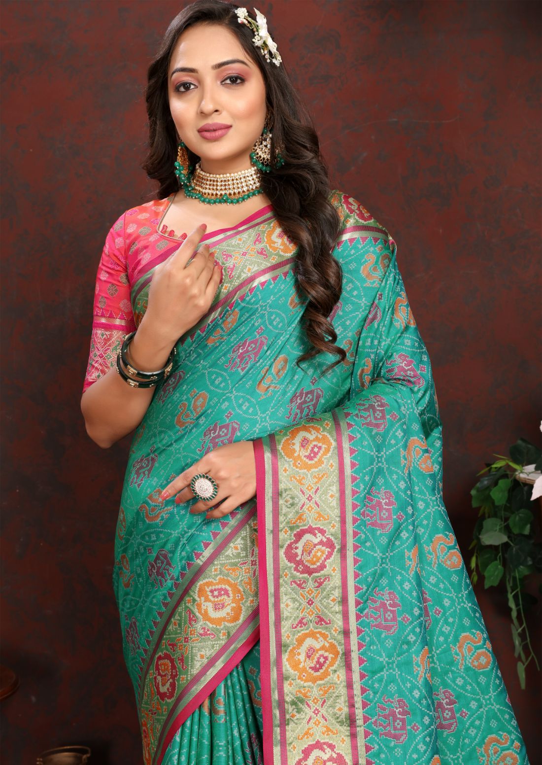Aqua Blue & Pink Women's Soft Patola Silk meenakari weawing motifs with Rich Zari Pallu and contrast border with Tessels.