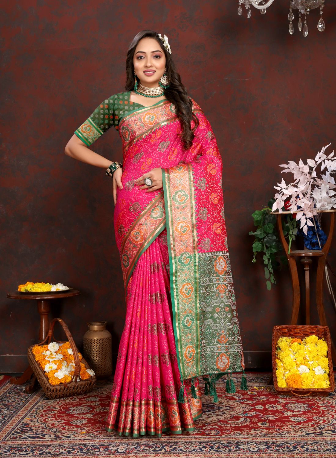 Pink & Green Women's Soft Patola Silk meenakari weawing motifs with Rich Zari Pallu and contrast border with Tessels.