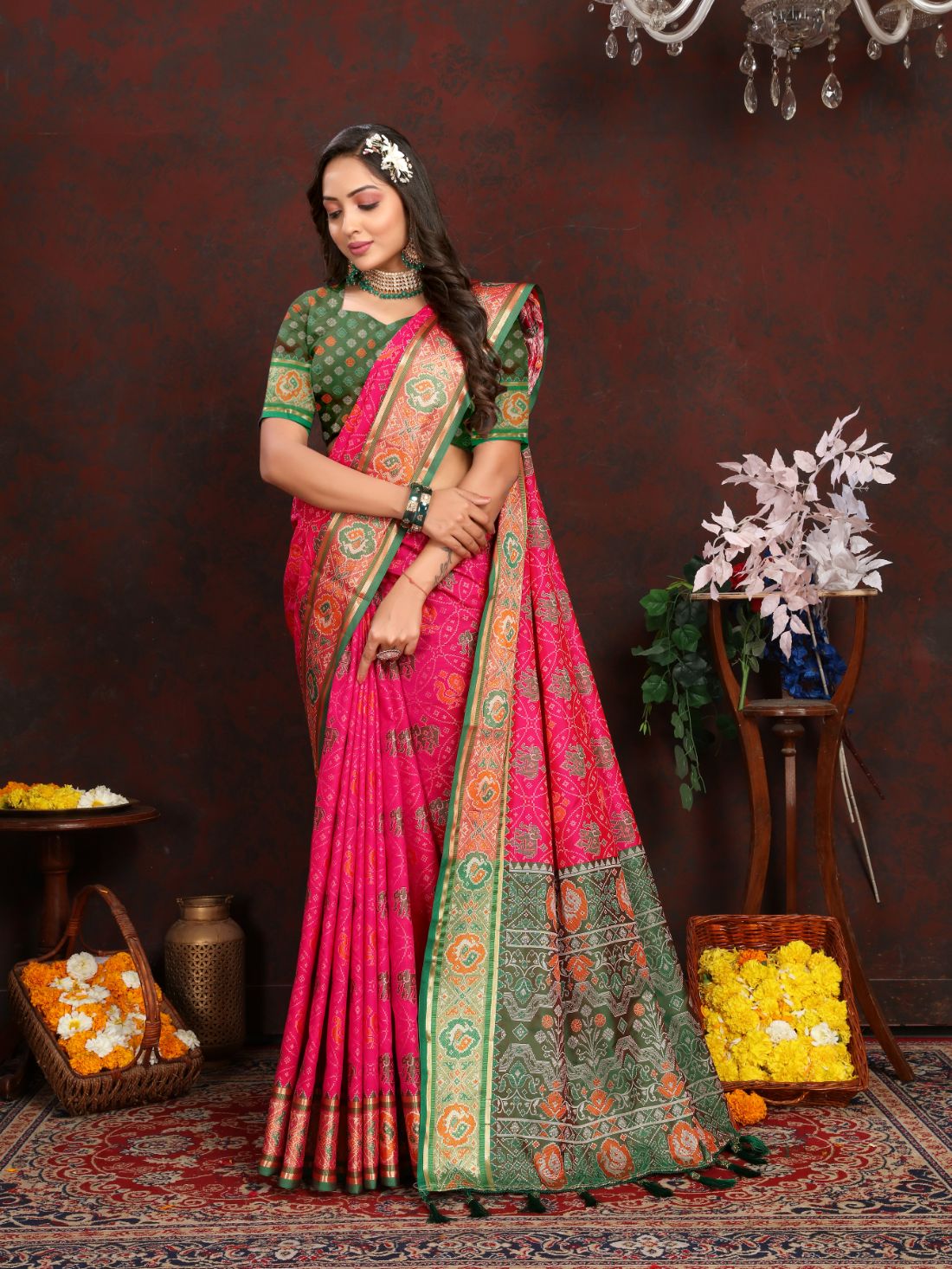 Pink & Green Women's Soft Patola Silk meenakari weawing motifs with Rich Zari Pallu and contrast border with Tessels.