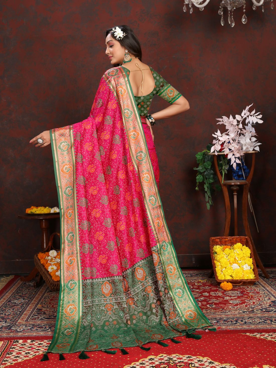 Pink & Green Women's Soft Patola Silk meenakari weawing motifs with Rich Zari Pallu and contrast border with Tessels.
