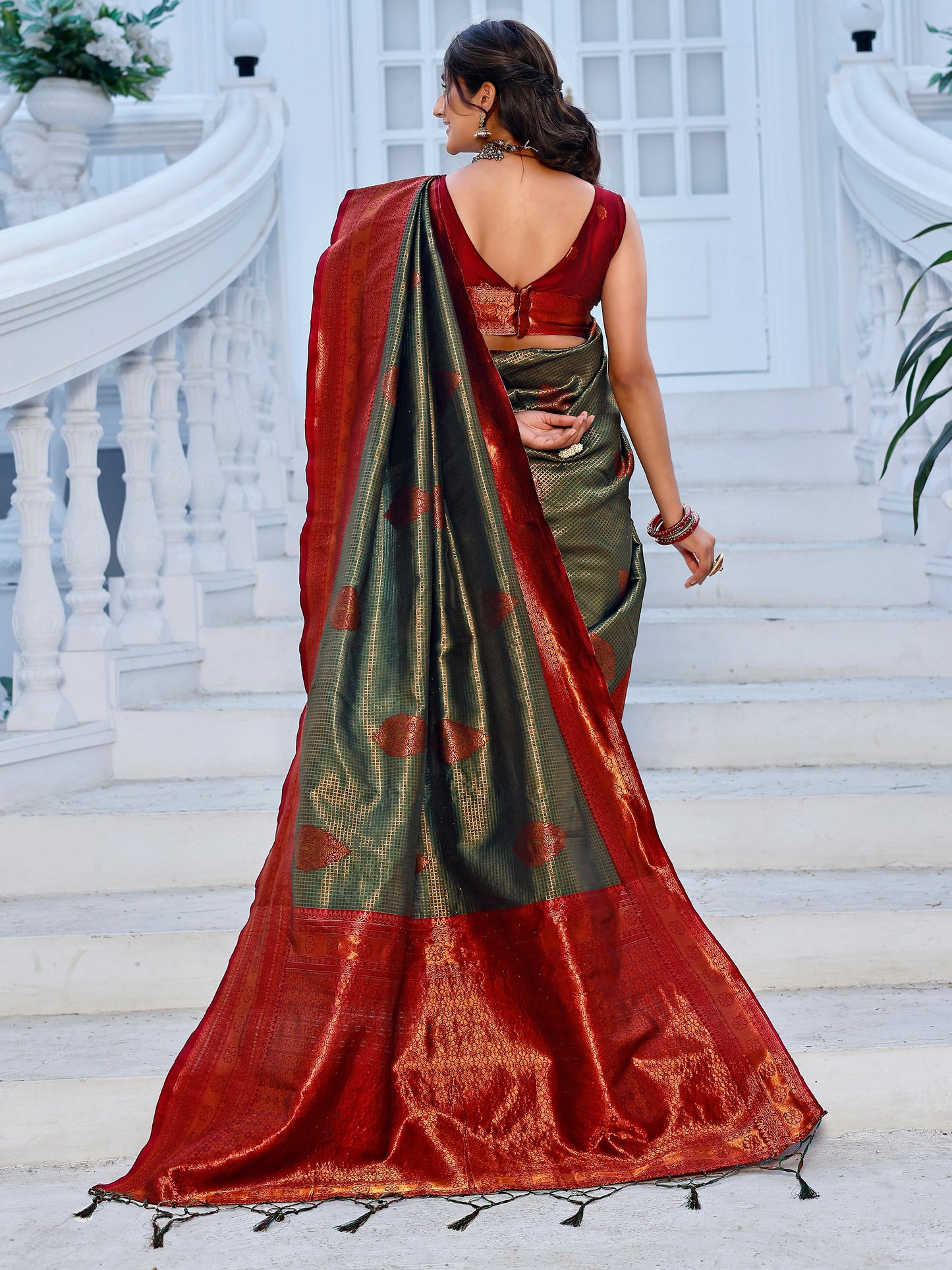 Regality Hunter Green and Coral Silk Saree with Intricate Zari Work