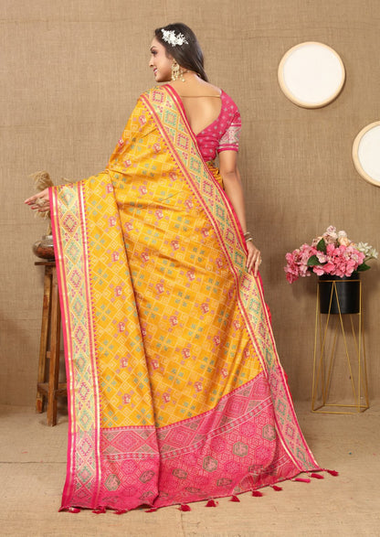 Mustered & Pink Color Women's Soft Patola Silk meenakari weawing motifs with Rich Zari Pallu and contrast border with Tessels.