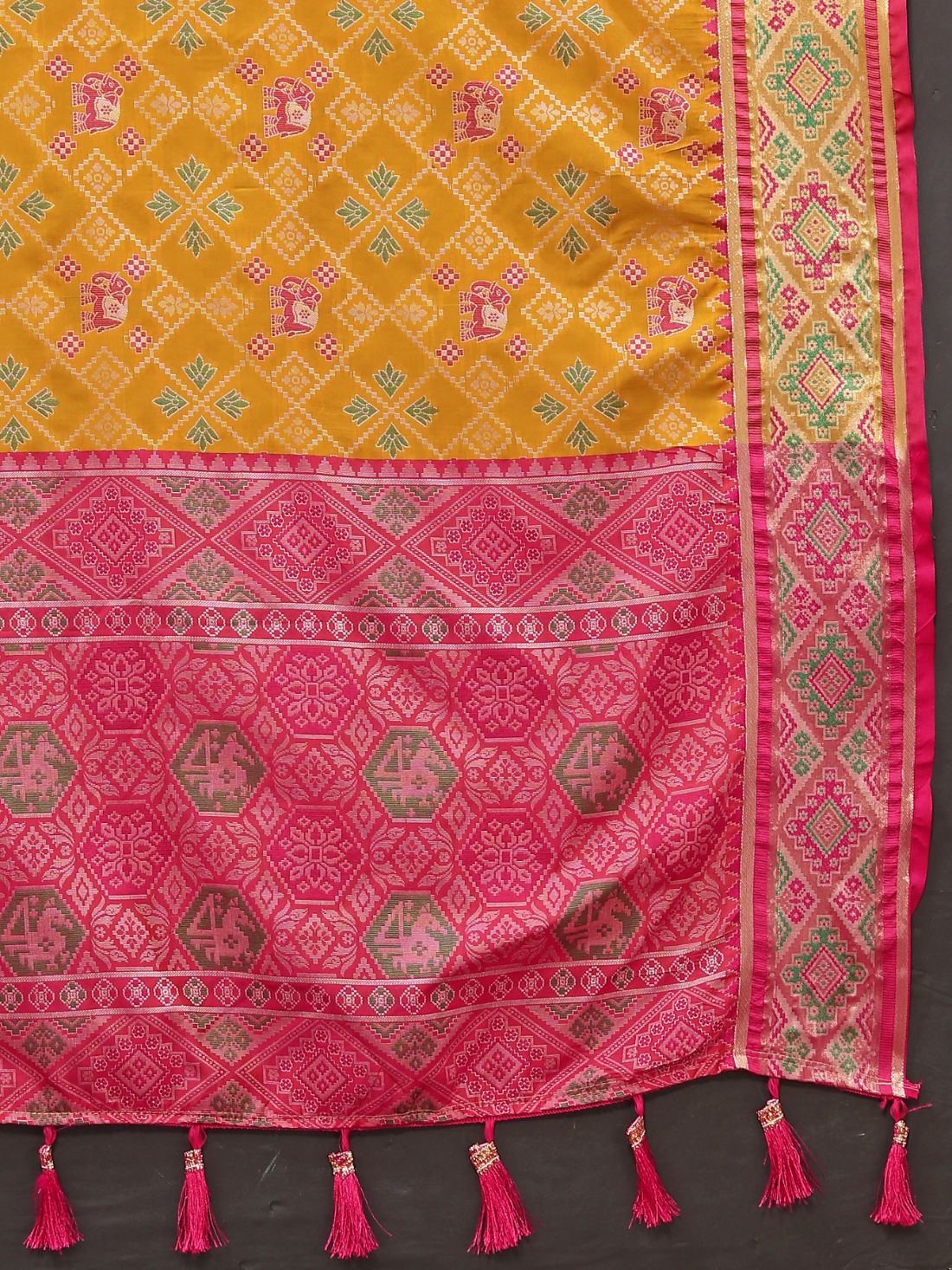 Mustered & Pink Color Women's Soft Patola Silk meenakari weawing motifs with Rich Zari Pallu and contrast border with Tessels.