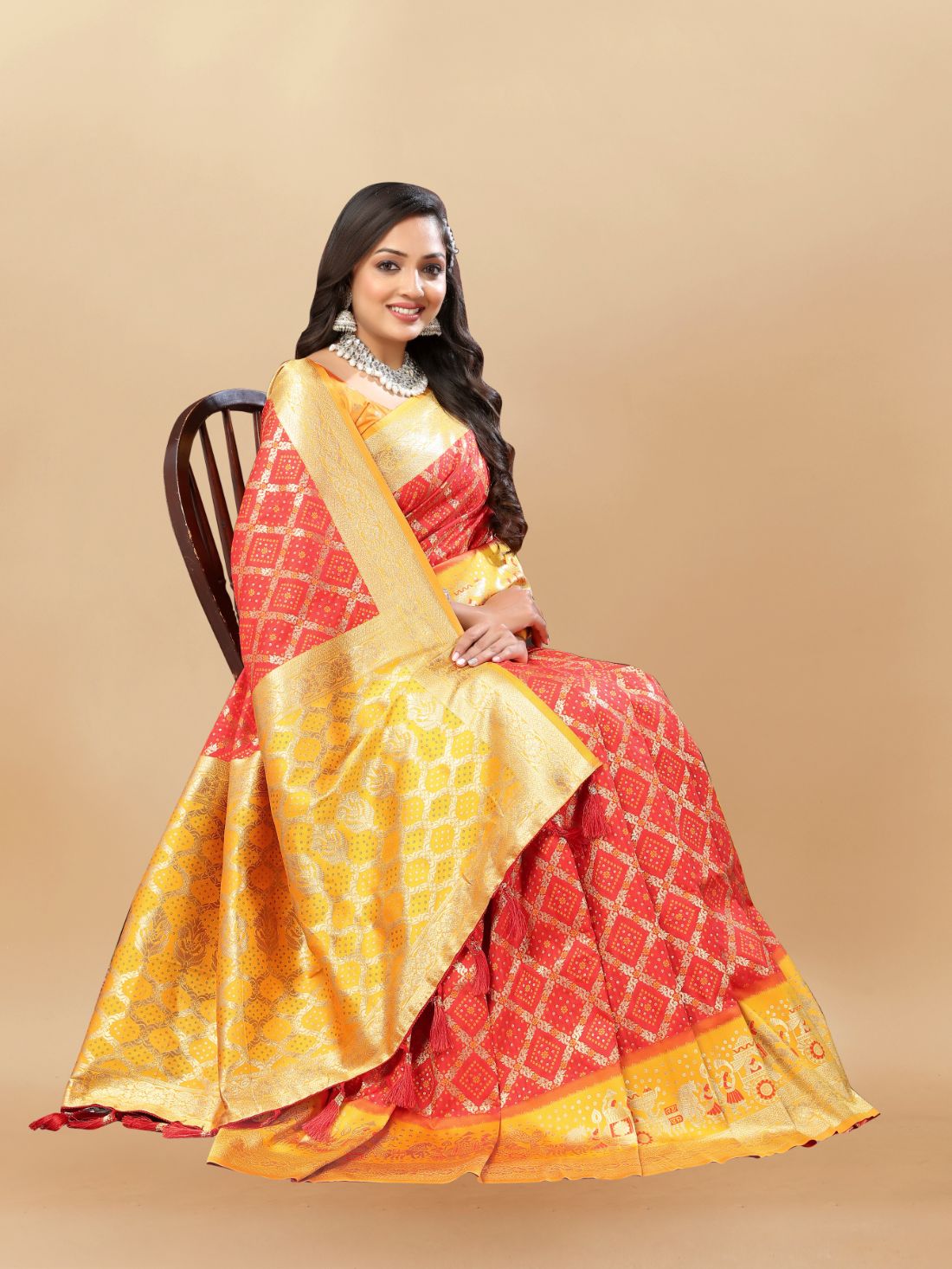 Red & Yellow Color Women's Soft Bandhani Printed Patola Silk meenakari weawing motifs with Rich Zari Pallu and contrast border with Tessels.