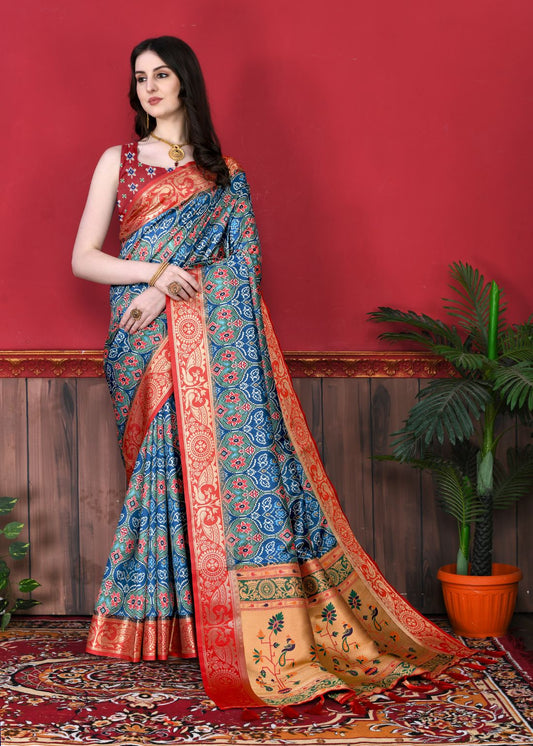 Blue Color Women's Soft Patola Silk meenakari weawing motifs with Rich Zari Pallu and contrast border with Tessels.