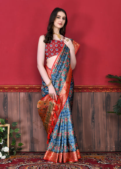 Blue Color Women's Soft Patola Silk meenakari weawing motifs with Rich Zari Pallu and contrast border with Tessels.