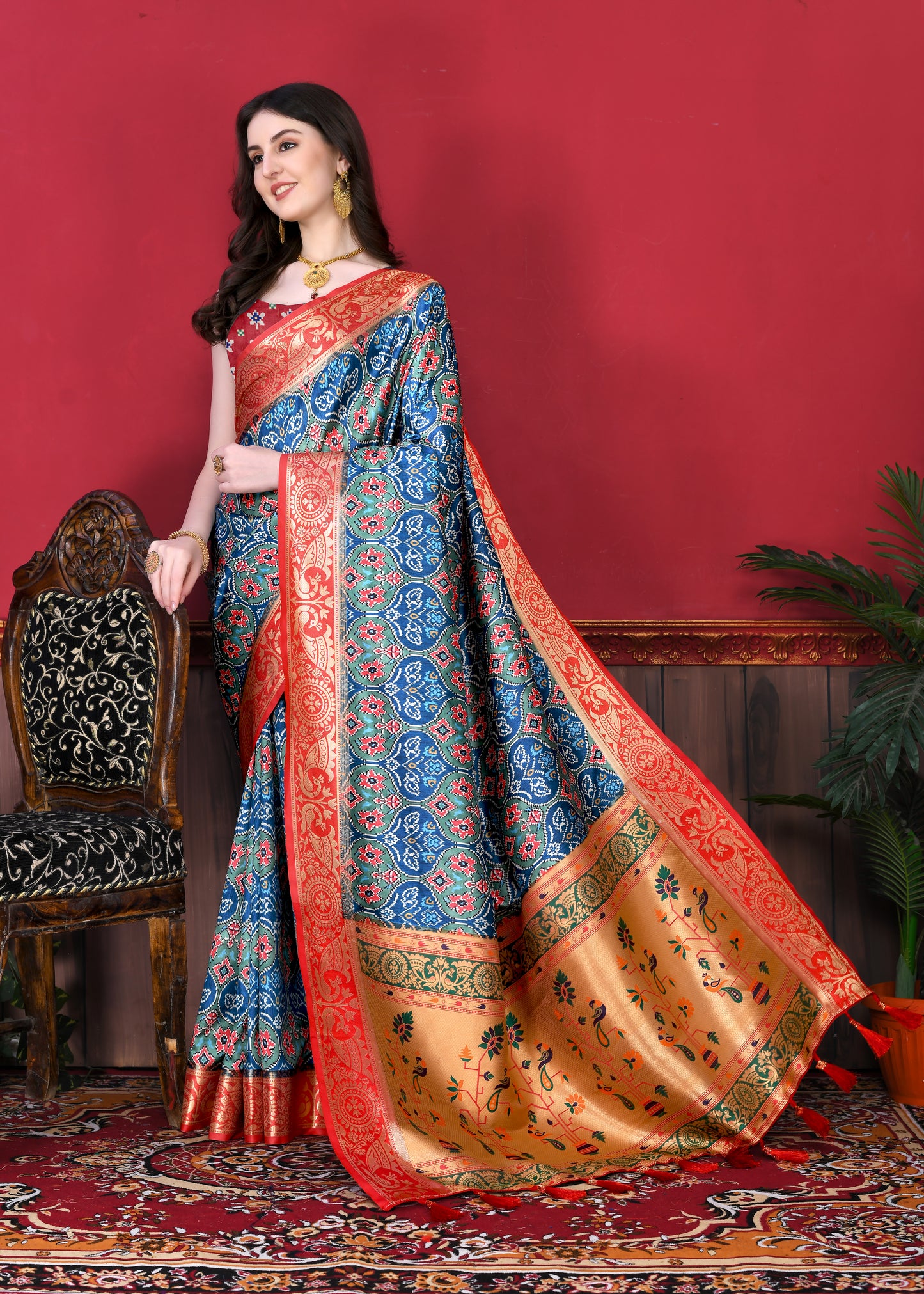 Blue Color Women's Soft Patola Silk meenakari weawing motifs with Rich Zari Pallu and contrast border with Tessels.