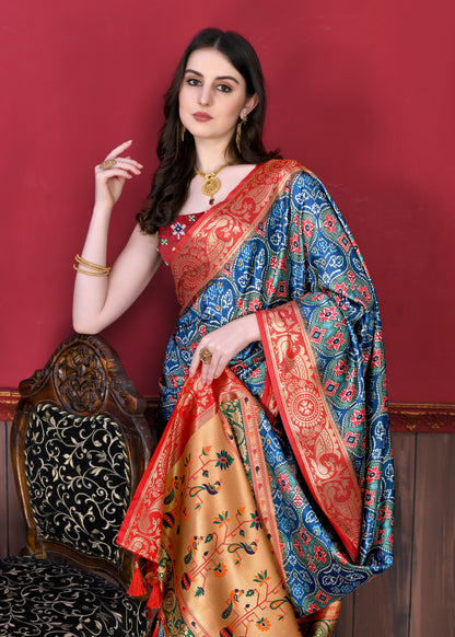 Blue Color Women's Soft Patola Silk meenakari weawing motifs with Rich Zari Pallu and contrast border with Tessels.