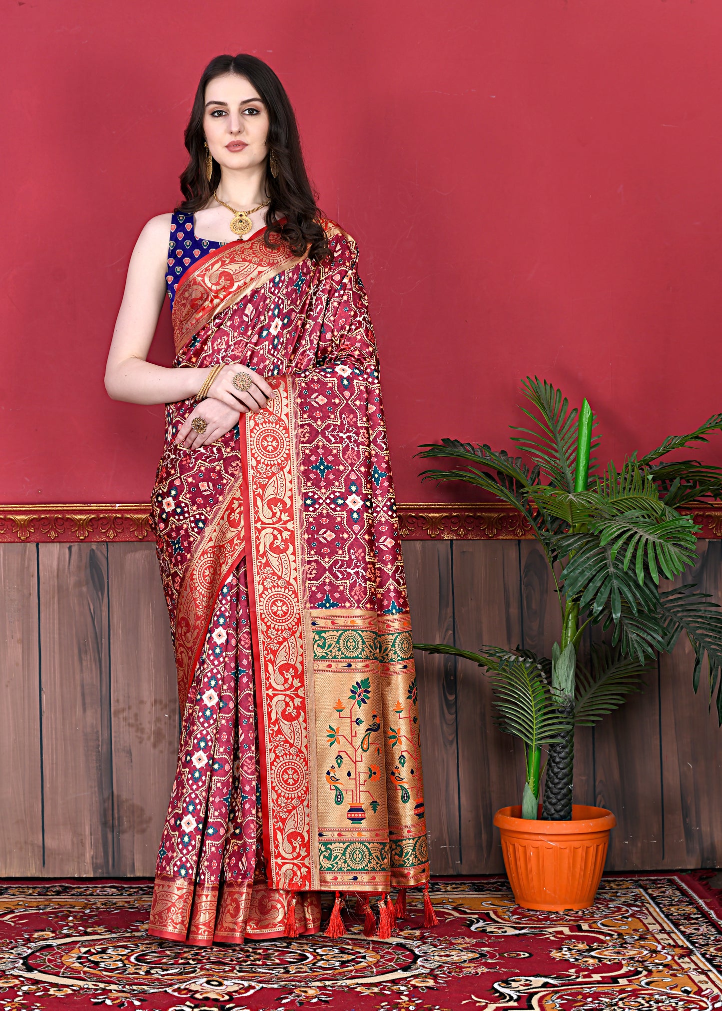 Maroon Color Women's Soft Patola Silk meenakari weawing motifs with Rich Zari Pallu and contrast border with Tessels.