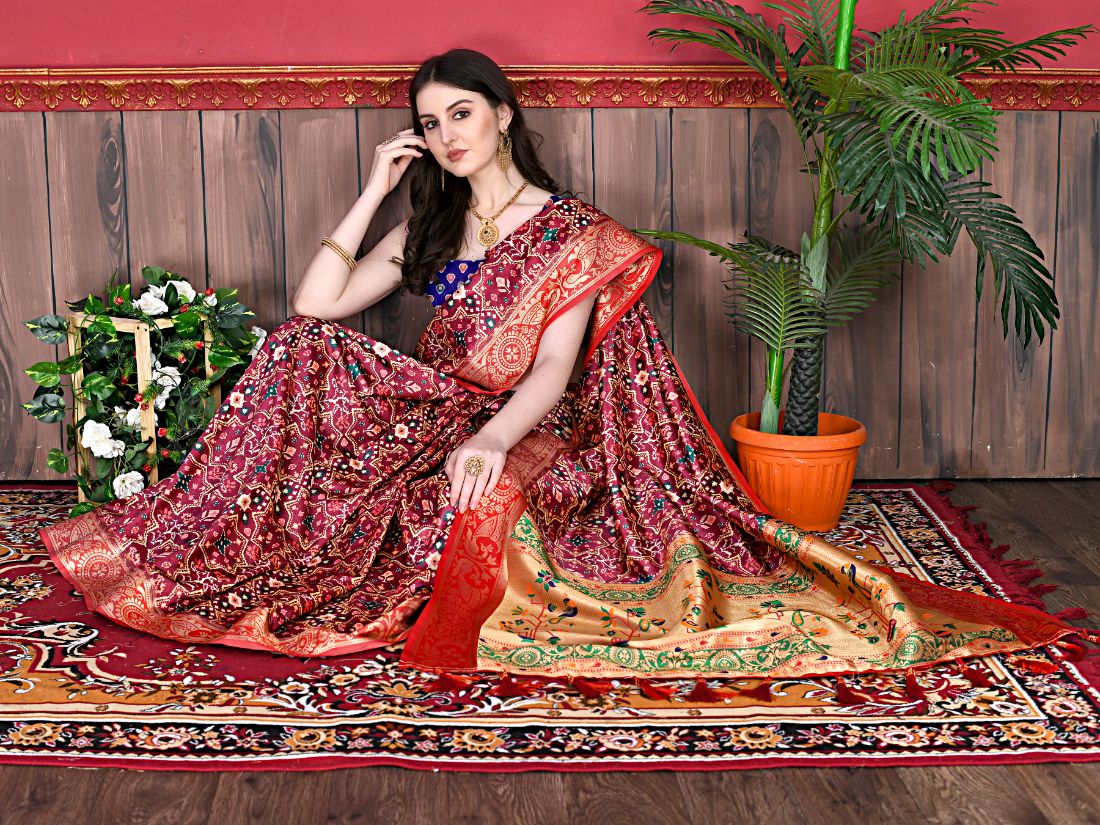 Maroon Color Women's Soft Patola Silk meenakari weawing motifs with Rich Zari Pallu and contrast border with Tessels.