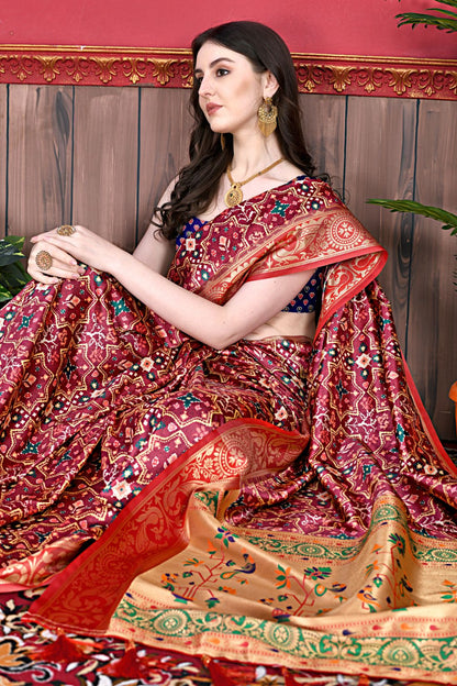 Maroon Color Women's Soft Patola Silk meenakari weawing motifs with Rich Zari Pallu and contrast border with Tessels.