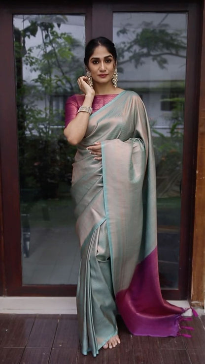 Magenta and Sky-blue Pure Banarasi Silk Saree With Twirling Blouse Piece.